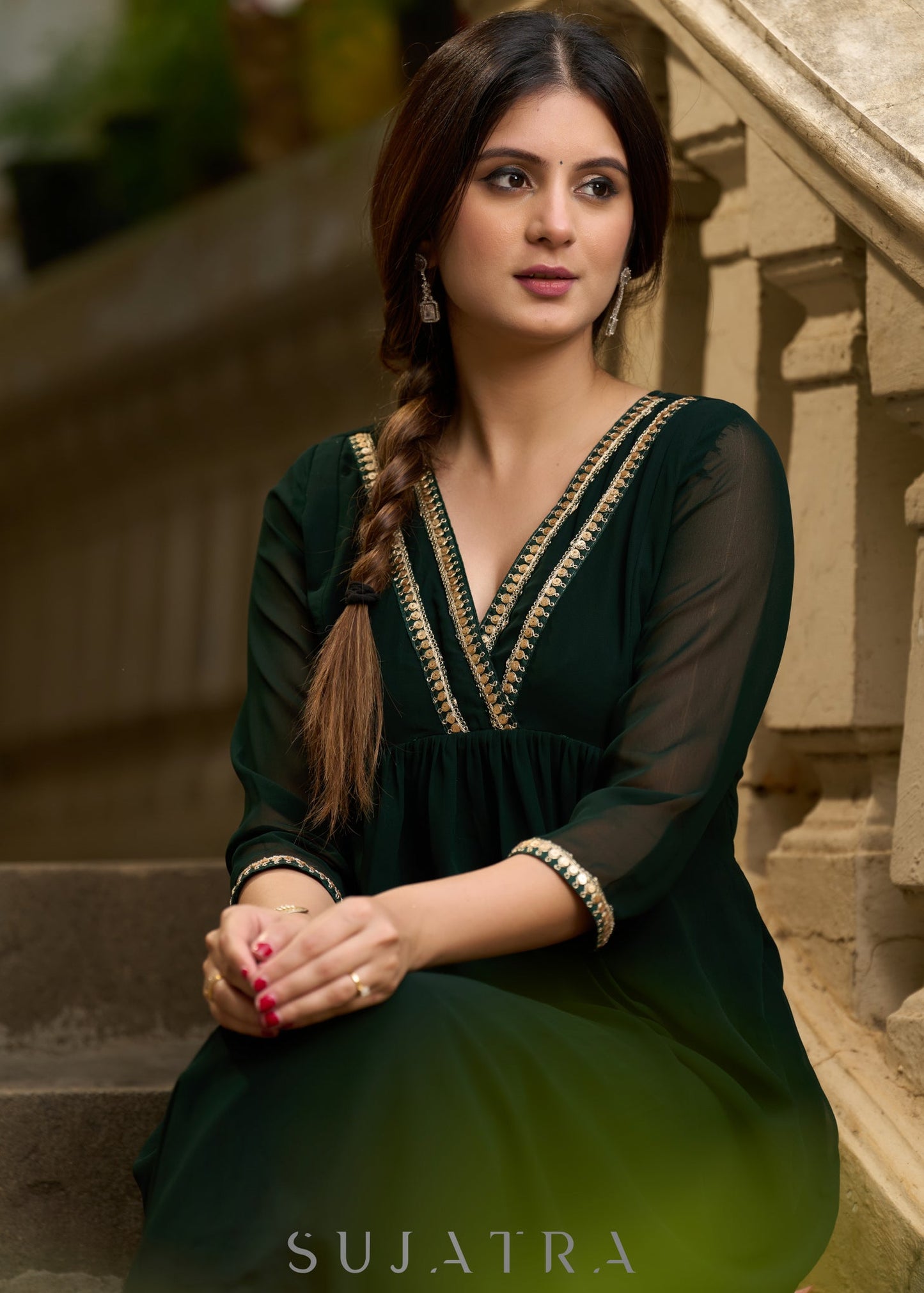 Elegance redefined in this captivating green georgette lace kurta and pant ensemble