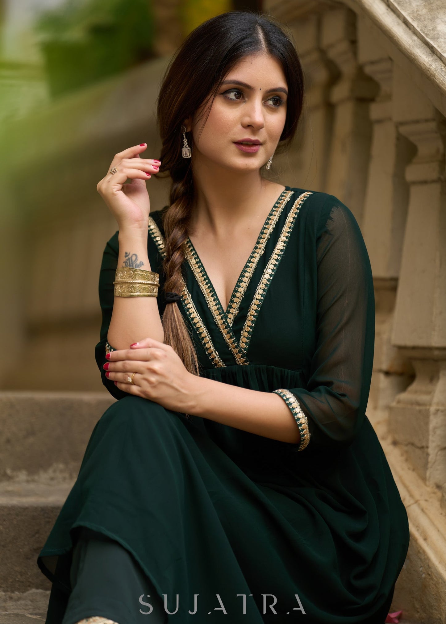Elegance redefined in this captivating green georgette lace kurta and pant ensemble