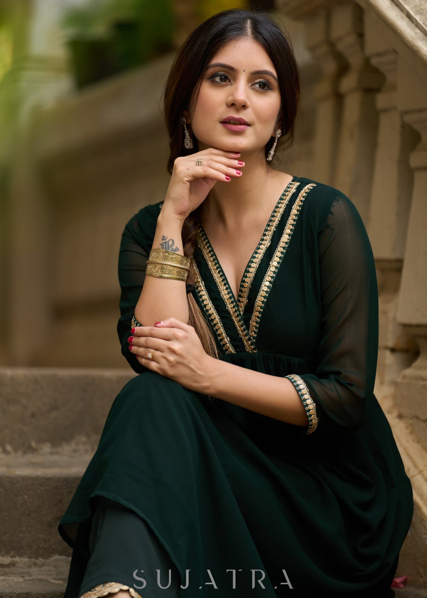 Elegance redefined in this captivating green georgette lace kurta and pant ensemble