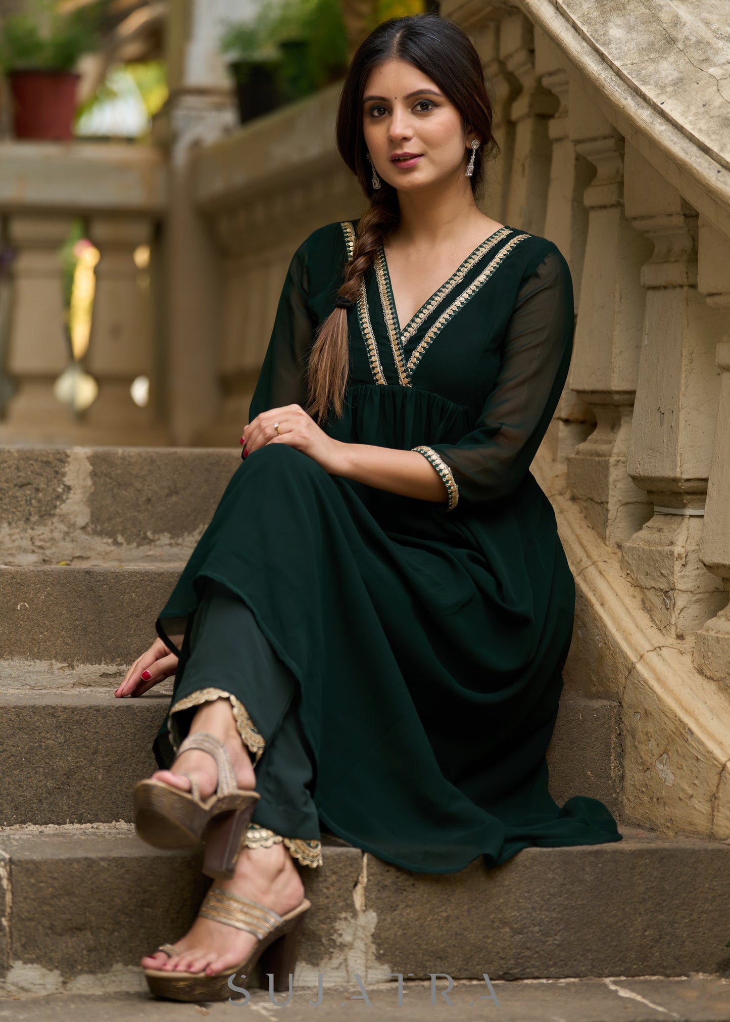 Elegance redefined in this captivating green georgette lace kurta and pant ensemble