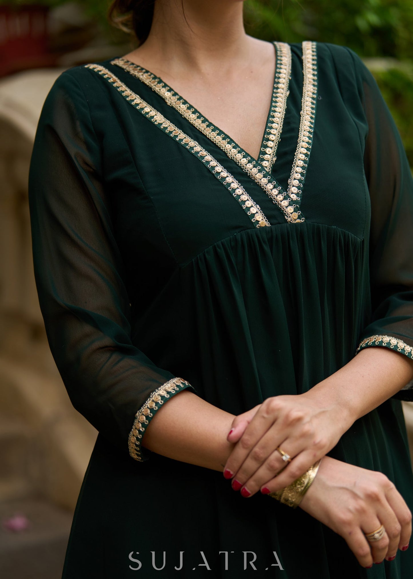 Elegance redefined in this captivating green georgette lace kurta and pant ensemble