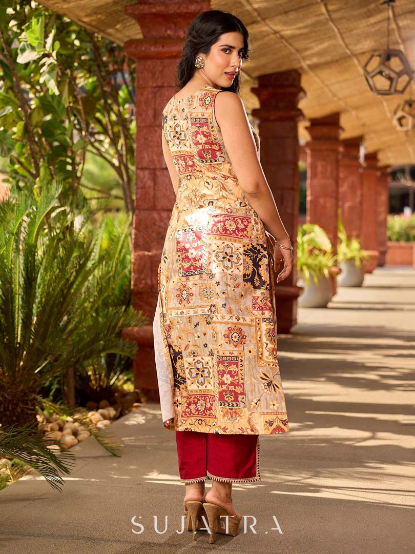 Graceful cream all-over printed kurta adorned with an overlapping maroon zardozi-embroidered neckline and bold maroon detailing.