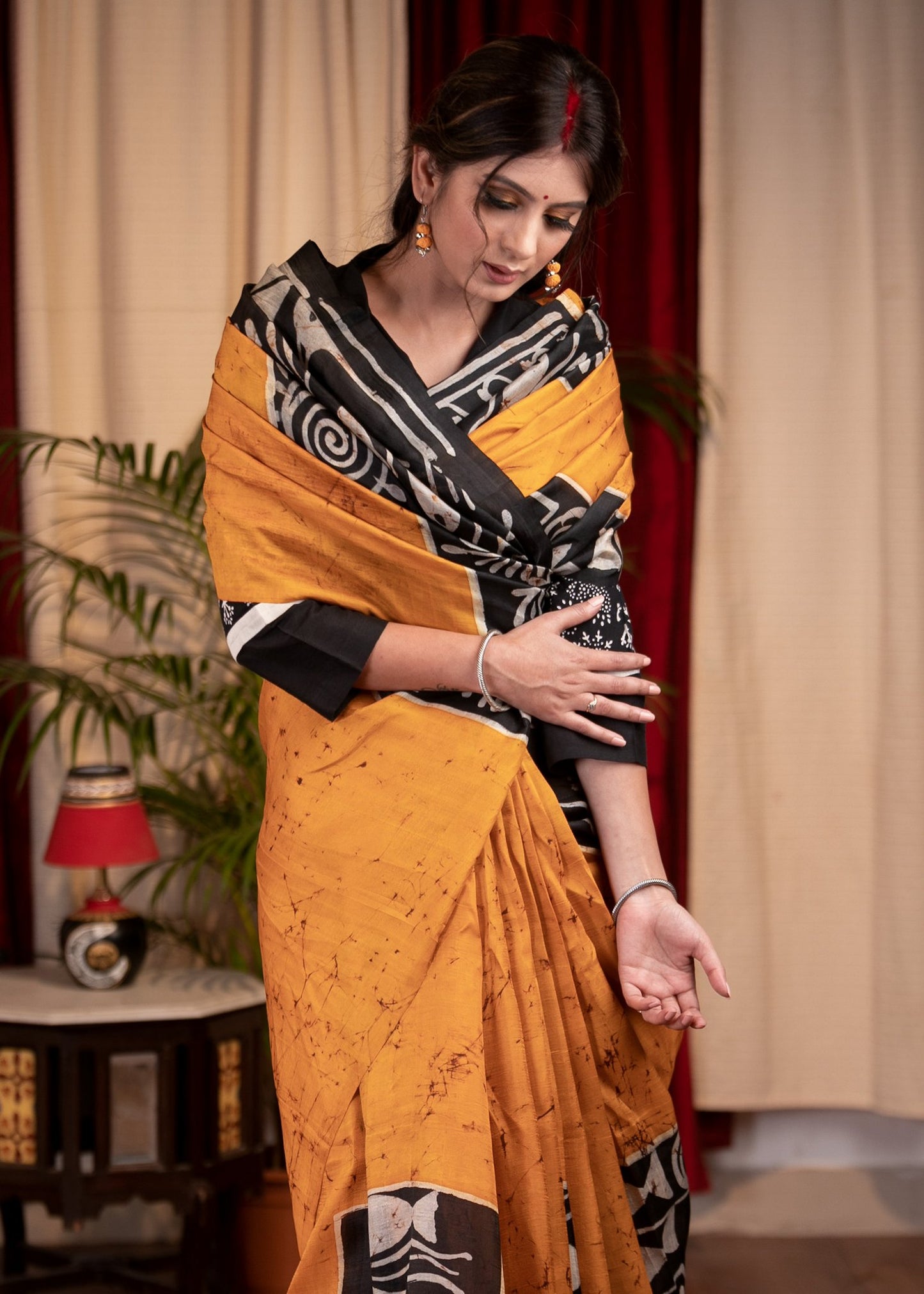 Exclusive pure silk hand batik mustard yellow saree with warli design motifs