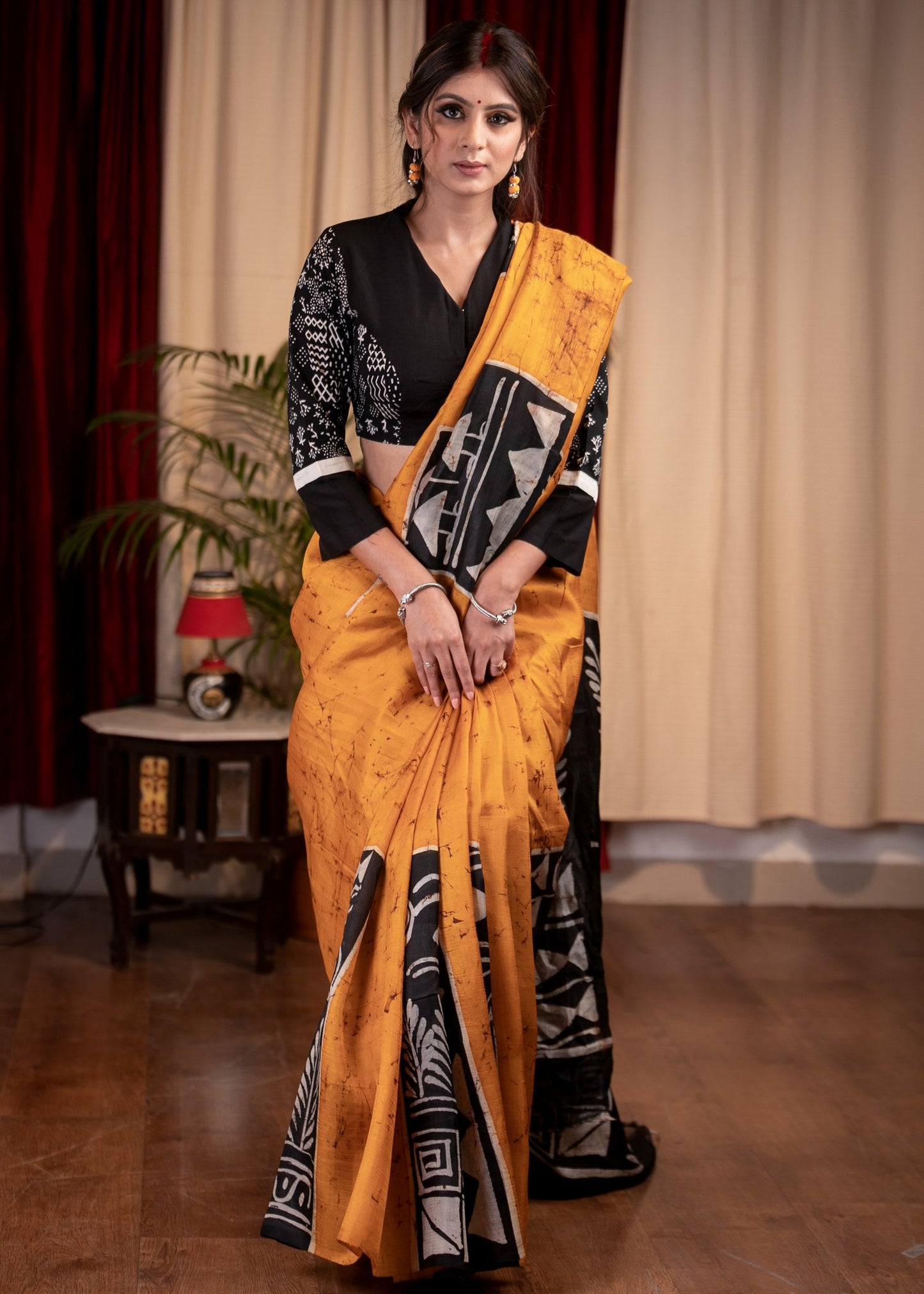 Exclusive pure silk hand batik mustard yellow saree with warli design motifs