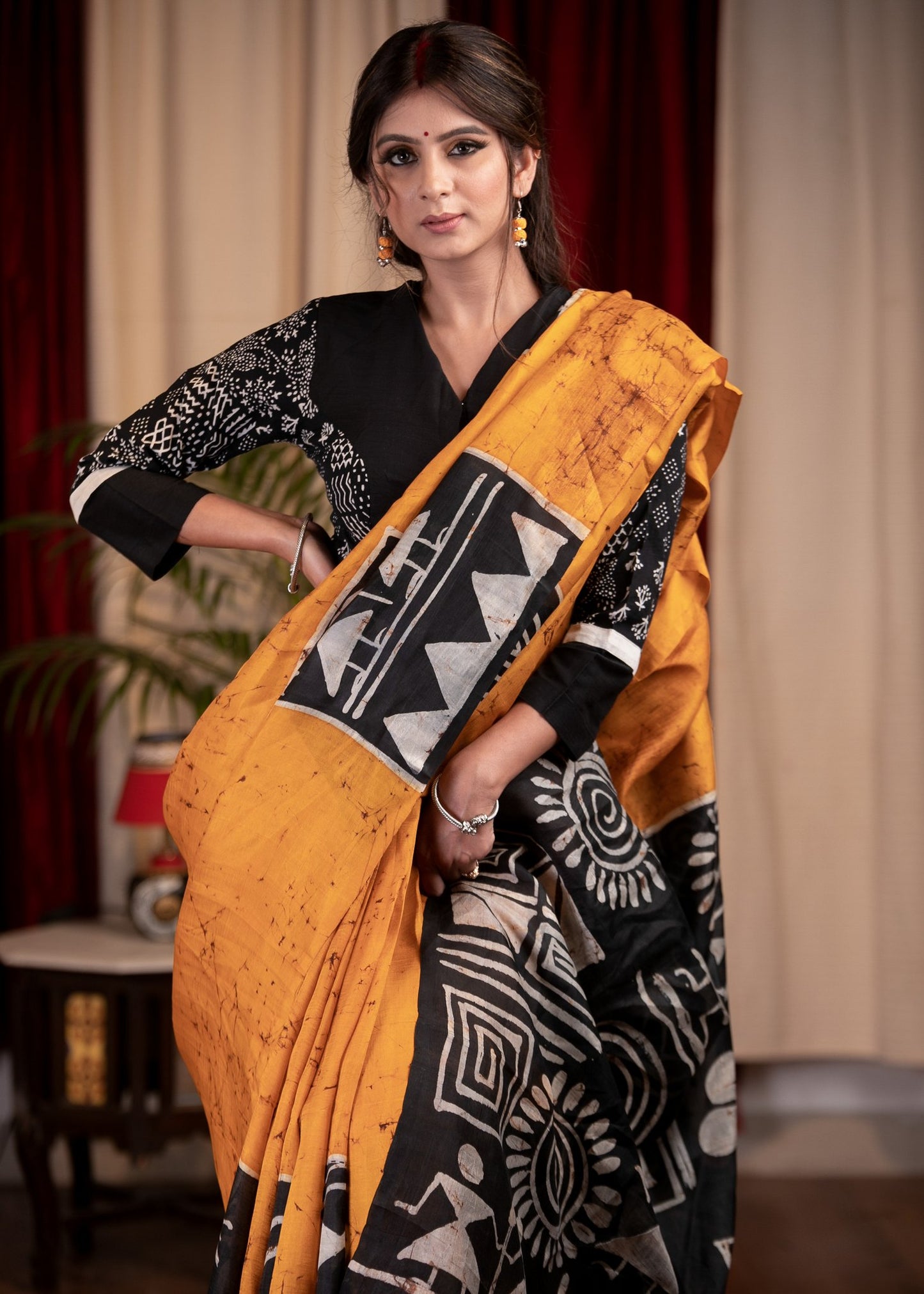 Exclusive pure silk hand batik mustard yellow saree with warli design motifs