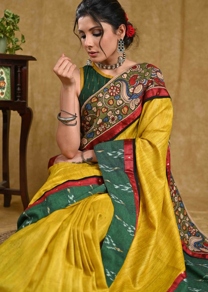 Stunning yellow Ghicha silk saree with Madhubani pallu and green Ikaat border