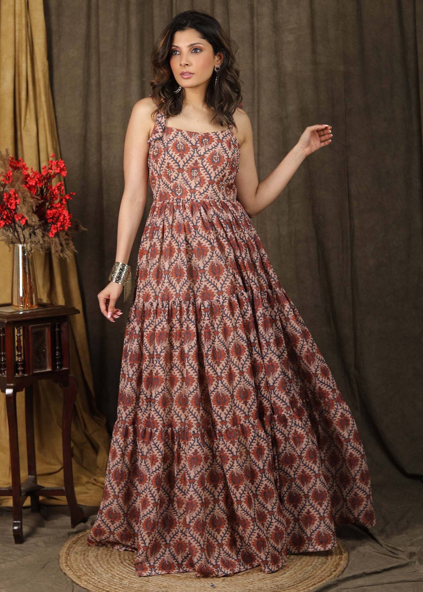 Exclusive boroque print peach maxi dress highlighted with stone embellishments and optional chanderi shrug