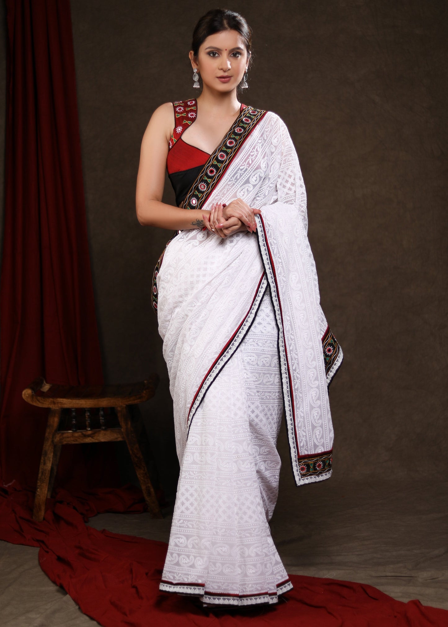 Heavy Chikankari Work Georgette White Saree Highlighted with Elegant Mirrorwork Lace