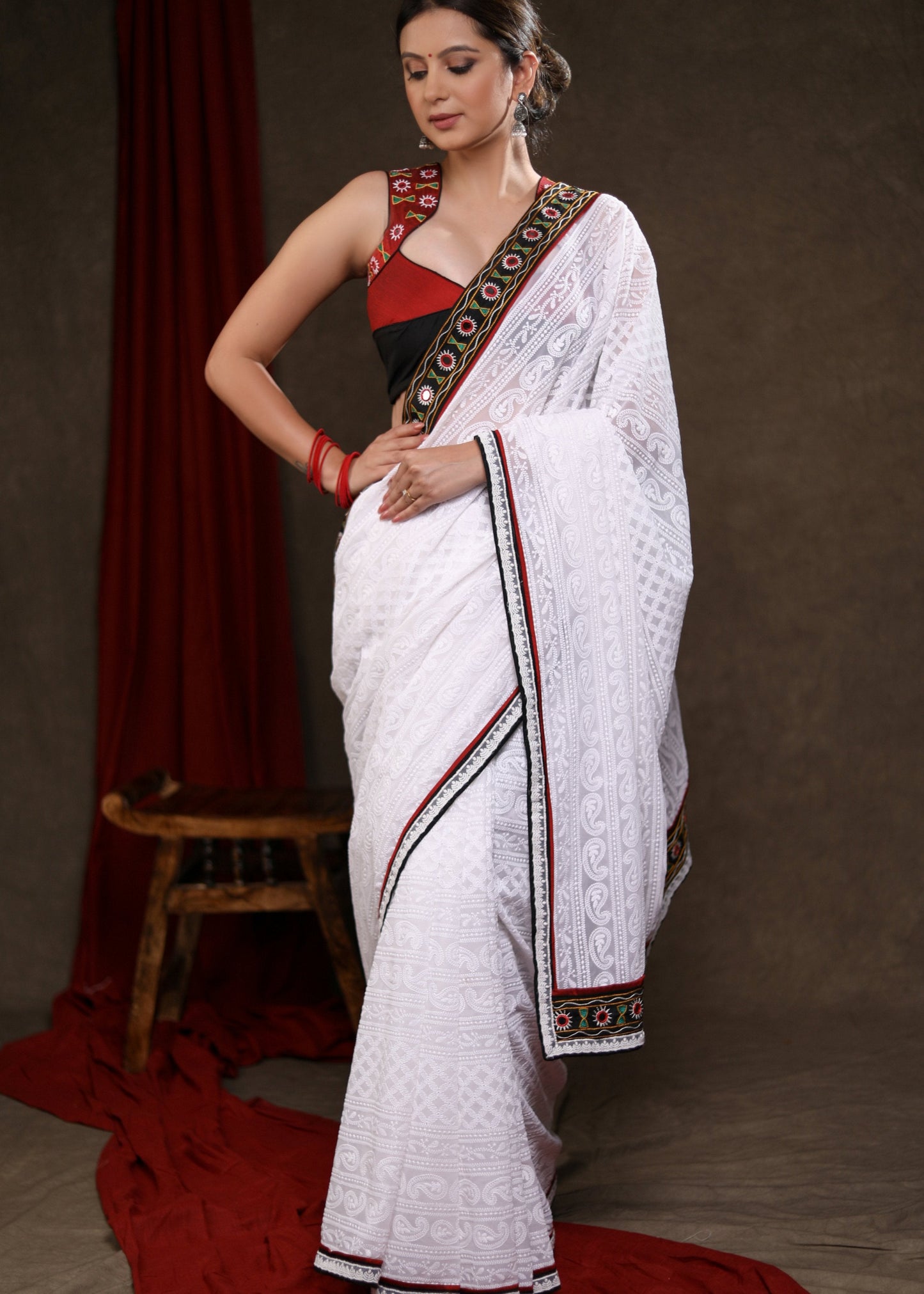 Heavy Chikankari Work Georgette White Saree Highlighted with Elegant Mirrorwork Lace