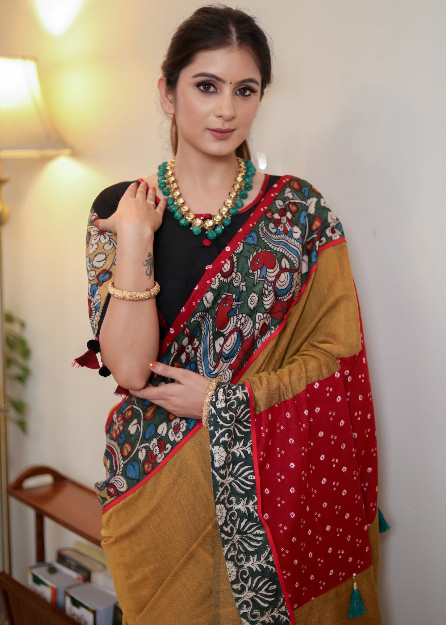 Beautiful mustard Cotton saree with Kalamkari hand painted border, red Bandhani Pallu and tassels