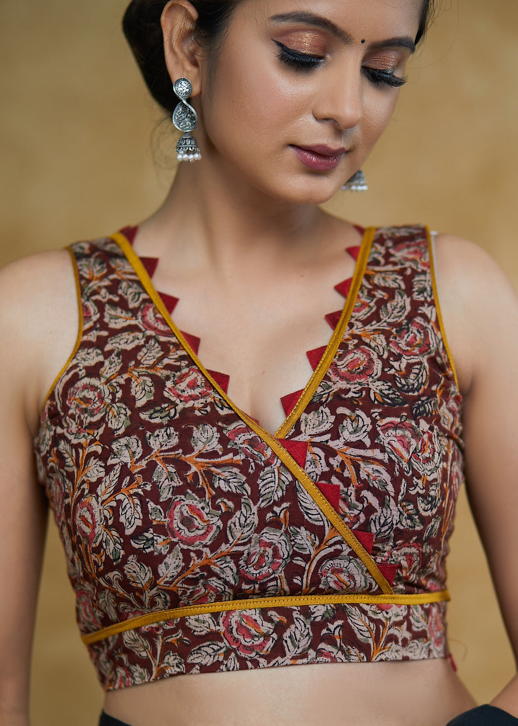 Exclusive Kalamkari Print Sleeveless Blouse with Mustard & Maroon Detailing