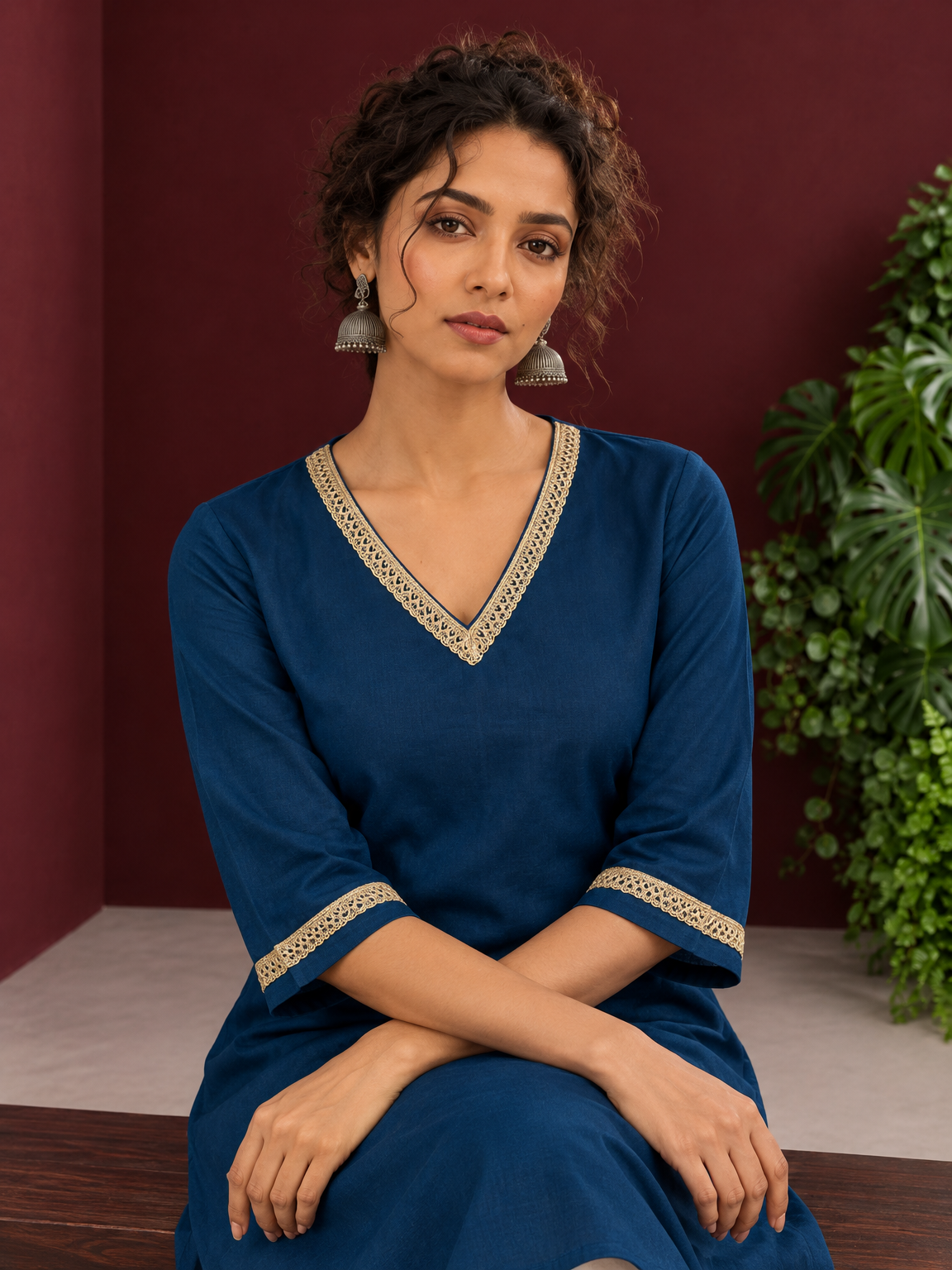Elegant Teal Blue Cotton Tunic with Embellished Gold Lace V-Neckline and Matching Sleeve Cuffs — seated detail