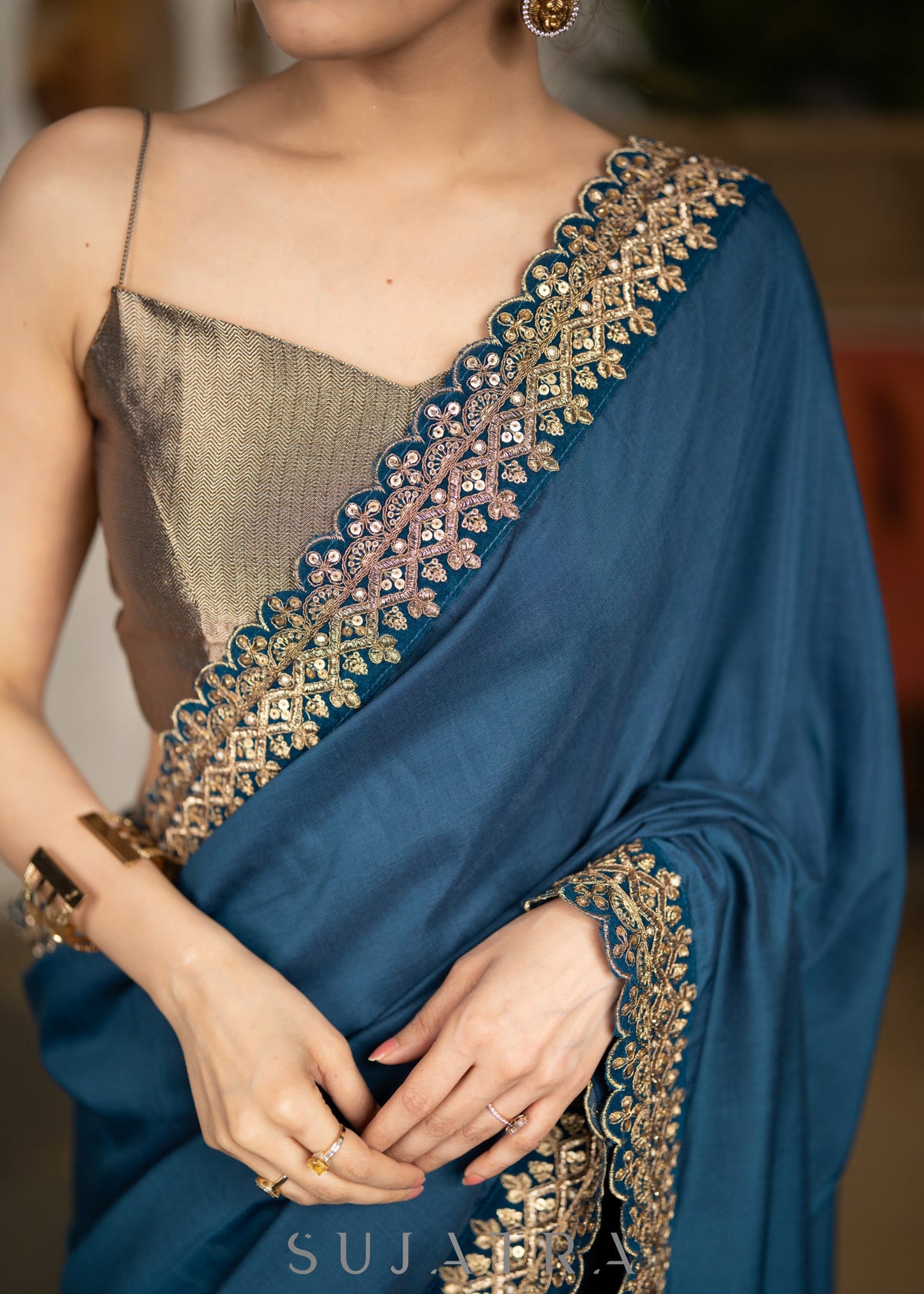Lustrous Teal Muslin Saree Highlighted With Beautiful Matching Lace