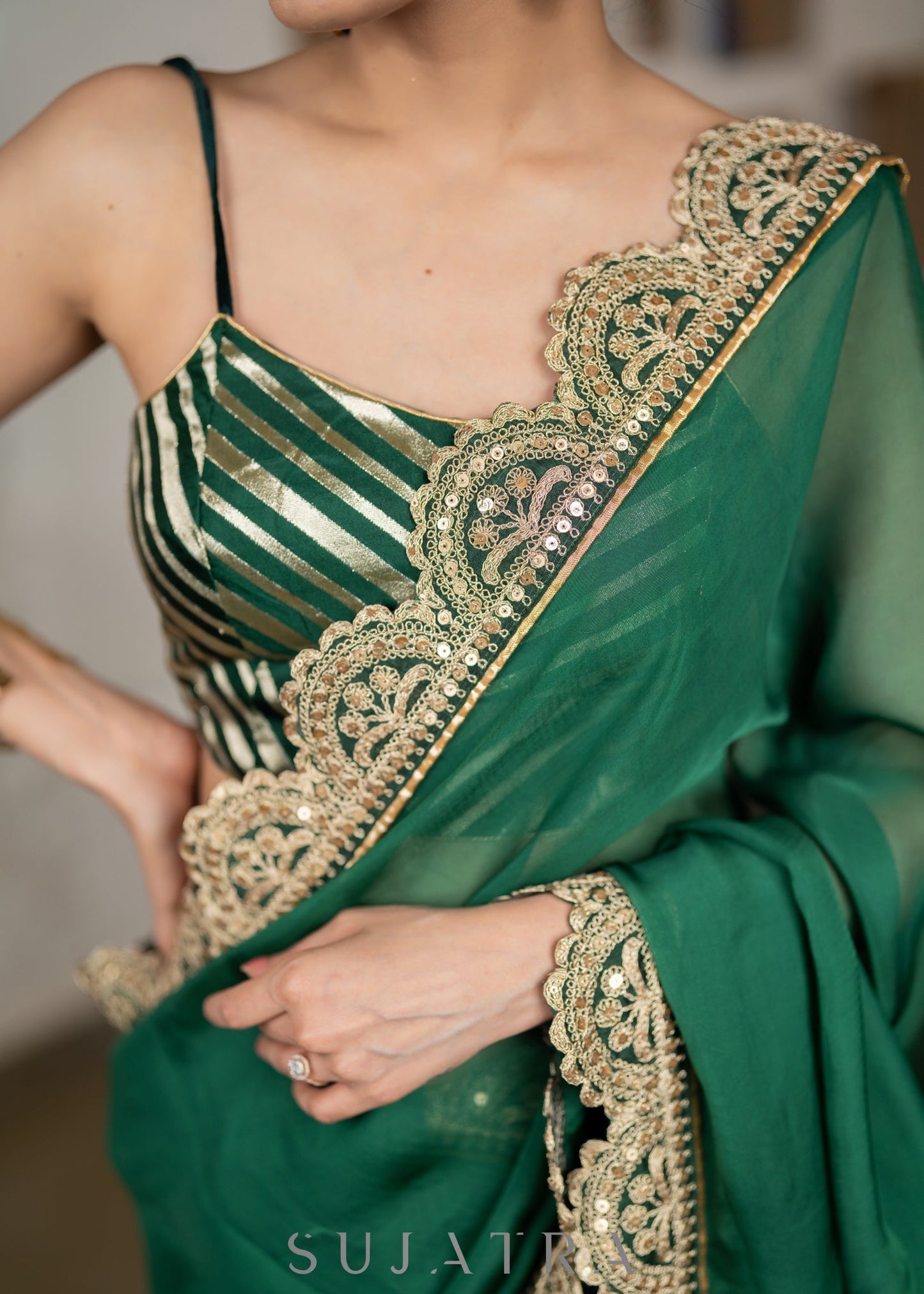 Graceful Bottle Green Organza Saree Highlighted With Matching Scalloped Lace