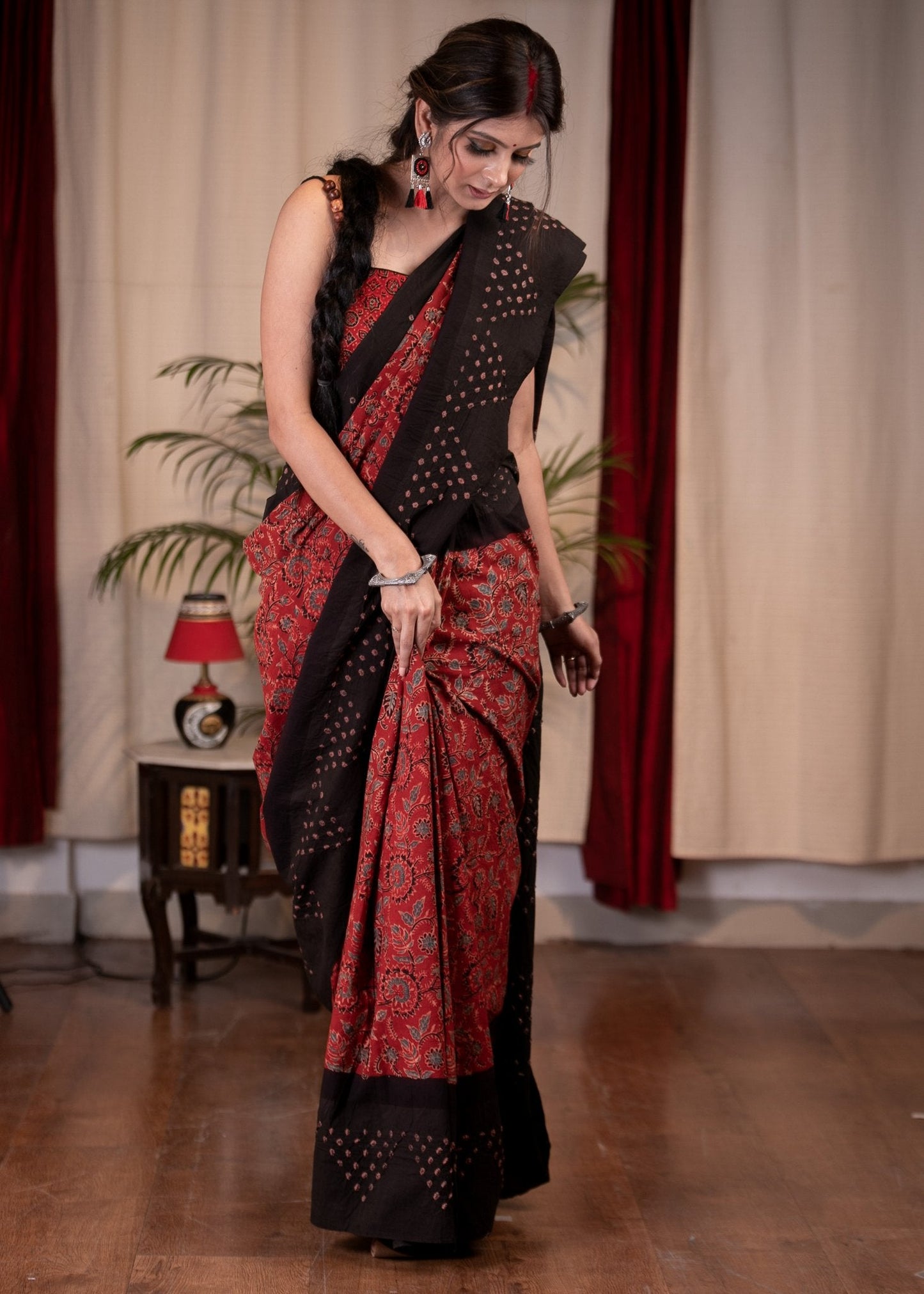 Exclusive maroon Ajrakh saree with Bandhej border