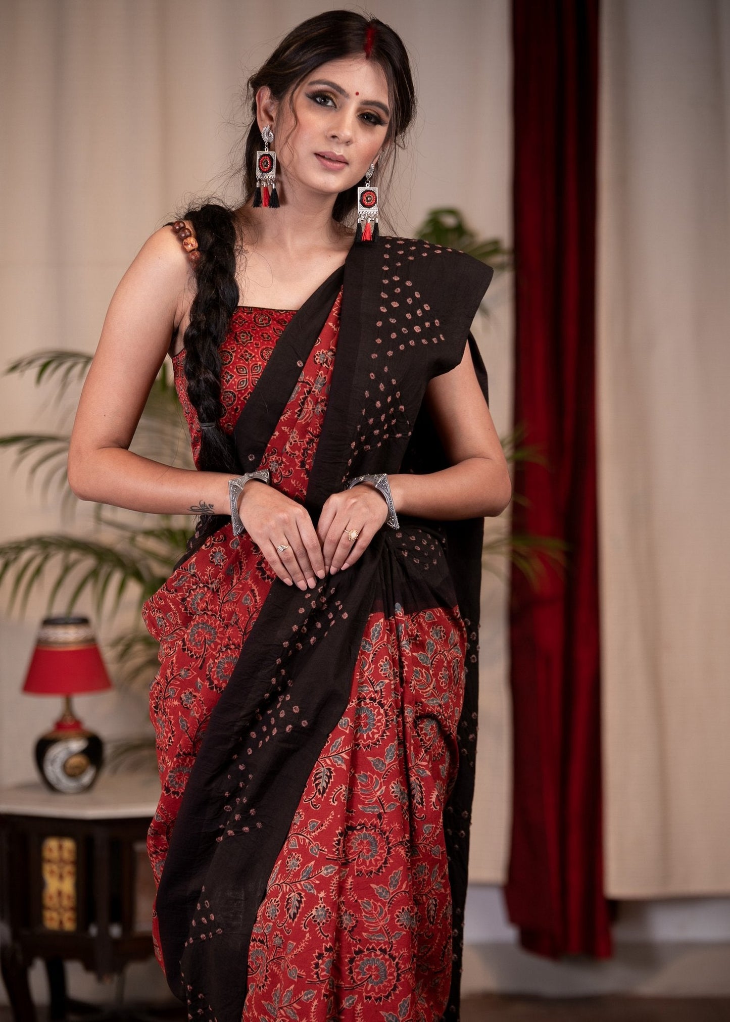 Exclusive maroon Ajrakh saree with Bandhej border