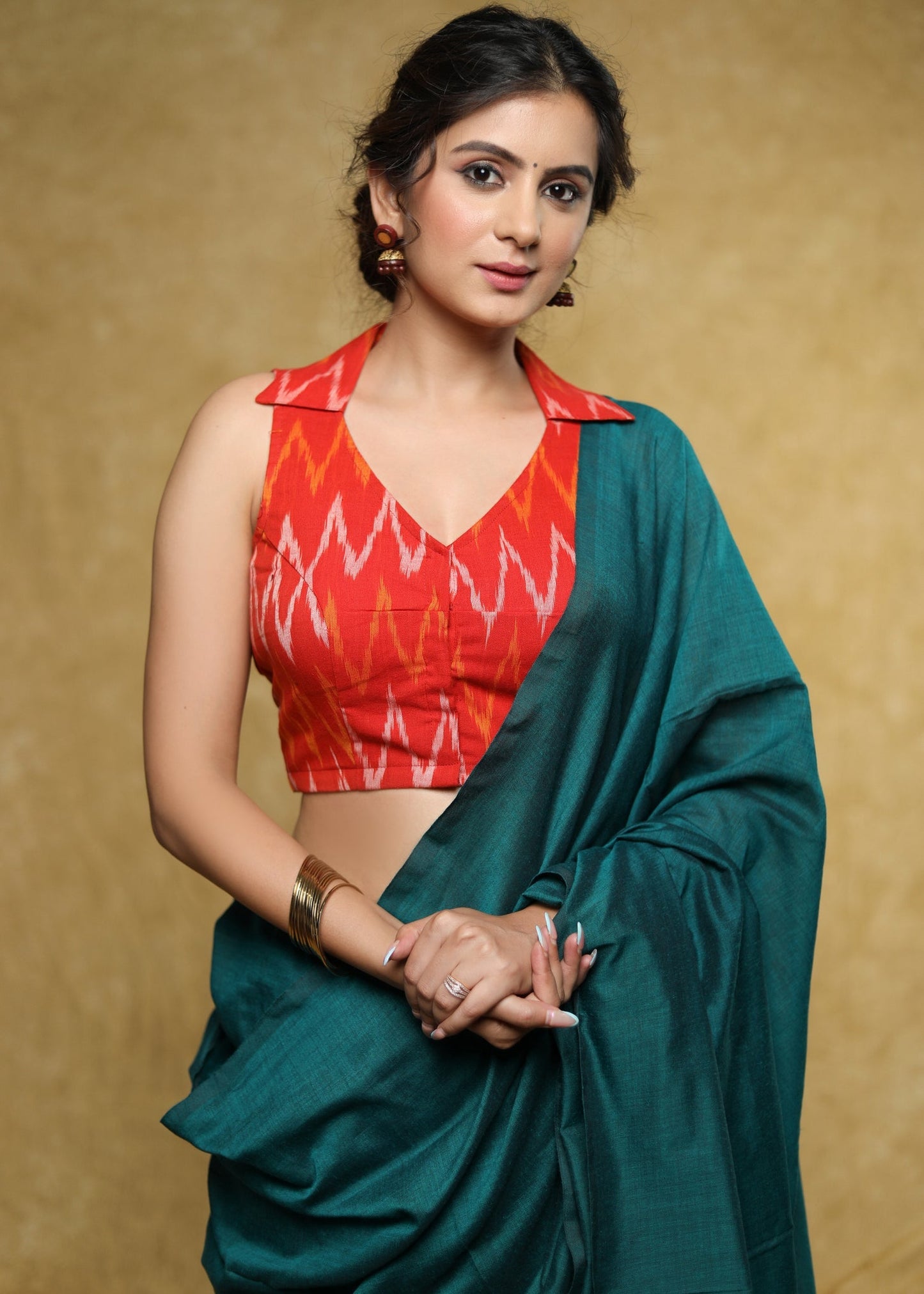 Graceful orange Cotton Ikat sleeveless blouse with smart collar and back
