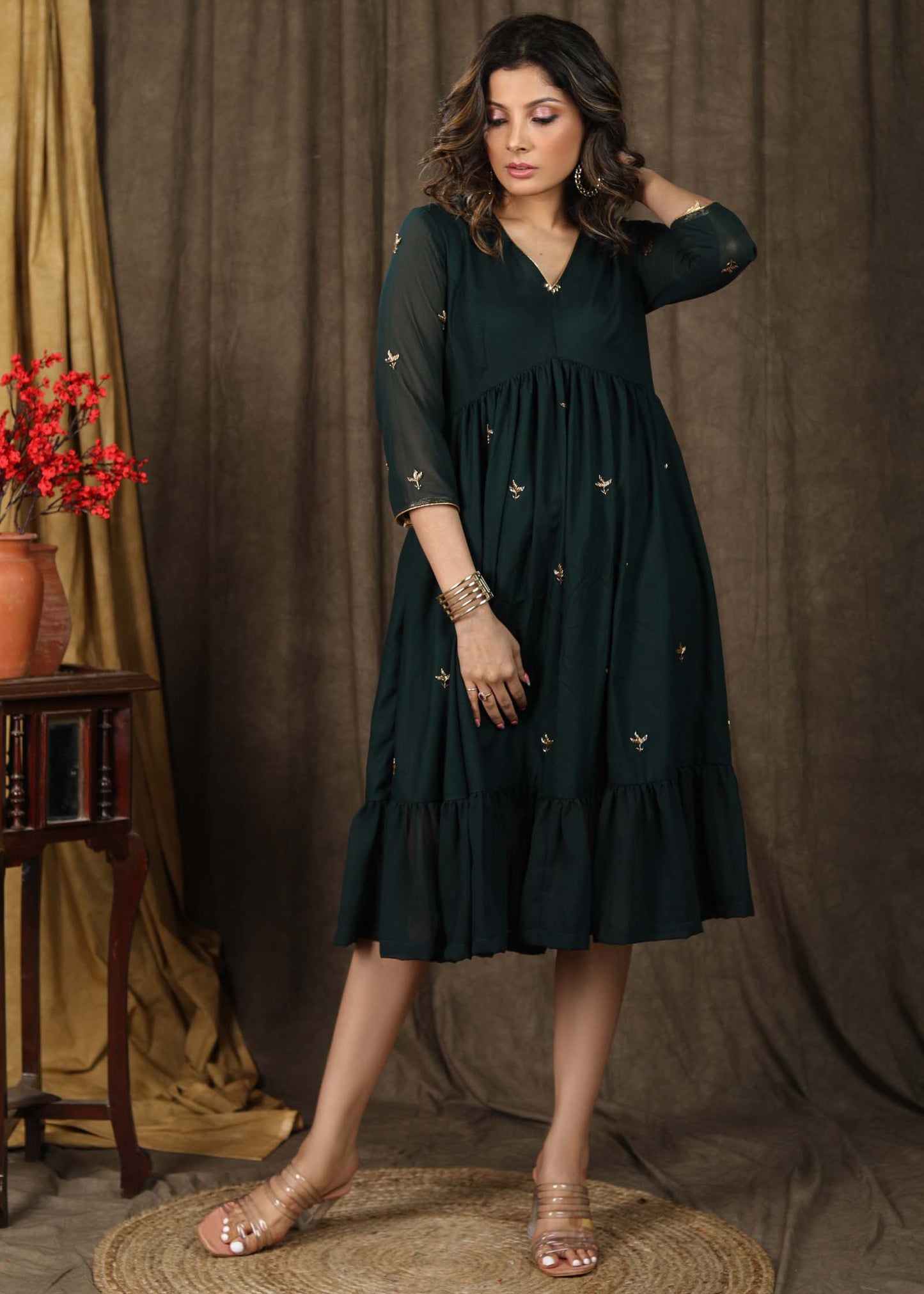 Beautiful bottle green gathered dress with minimal hand embroidery and georgette hemline
