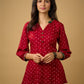 Red rayon bandhani top beautifully combined with classic ikat collar.