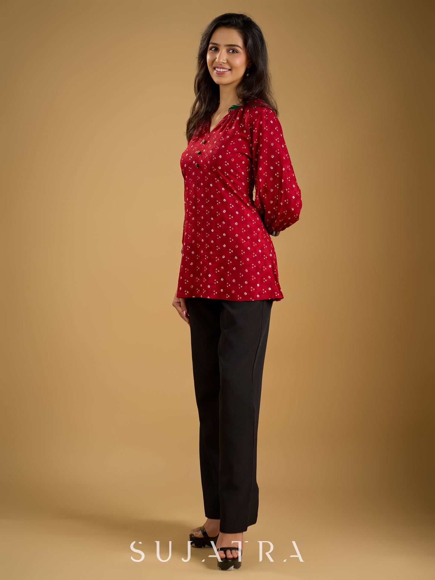 Red rayon bandhani top beautifully combined with classic ikat collar.