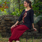 Classic Black Cotton Silk Top Featuring Delicate Mirror Work Accents And A Bold Maroon Placket
