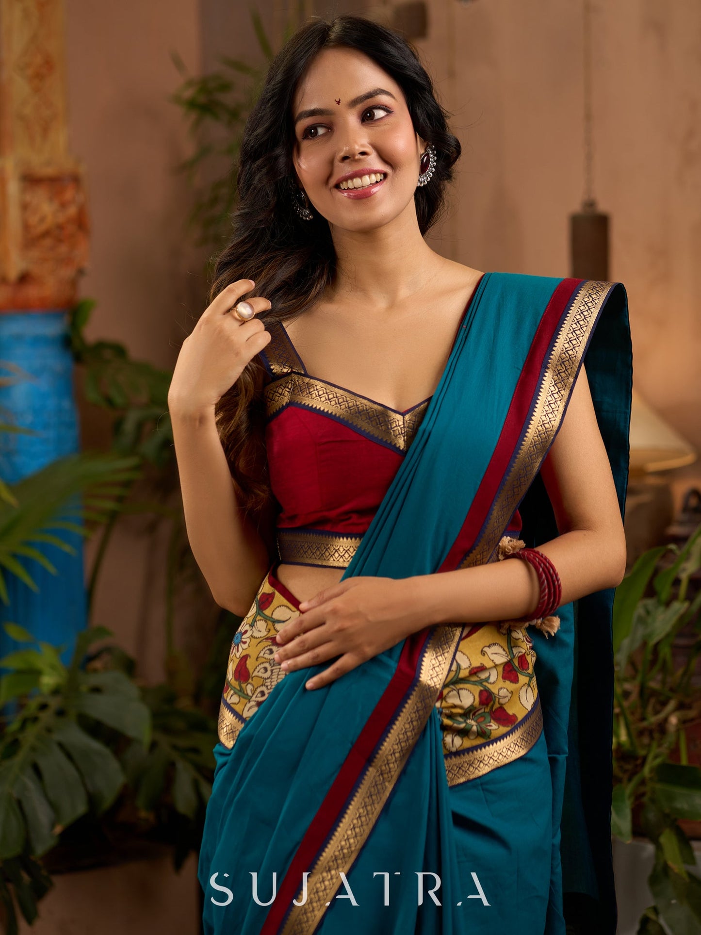 Teal cotton saree with Kalamkari border and rich khun border detailing