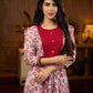 Elegant white floral Jaipuri printed dress with a delicately pintucked red panel, gathered sleeves, and rich red accents.