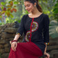 Classic Black Cotton Silk Top Featuring Delicate Mirror Work Accents And A Bold Maroon Placket