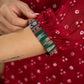 Red rayon bandhani top beautifully combined with classic ikat collar.