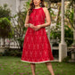 Statement red Ikat halter-neck dress accented in white, designed with a box pleat at the neckline for fluid drape.