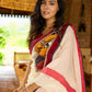 Striking white cotton saree with bold red-black borders, featuring a hand-painted Durga motif