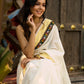 Exclusive off white mul saree with yellow hakoba border paired with Kutch mirror work border