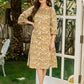 Soft Beige Printed Mul Cotton Dress with Sleek Boat Neck and Bold Contrast Piping