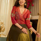 Luminous Green tissue lehenga with a classic Red Angrakha choli featuring intricate hand embroidery.