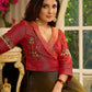 Luminous Green tissue lehenga with a classic Red Angrakha choli featuring intricate hand embroidery.