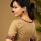 Exquisite hand embroidered dark beige ajrakh combination cotton blouse.