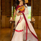 Striking white cotton saree with bold red-black borders, featuring a hand-painted Durga motif