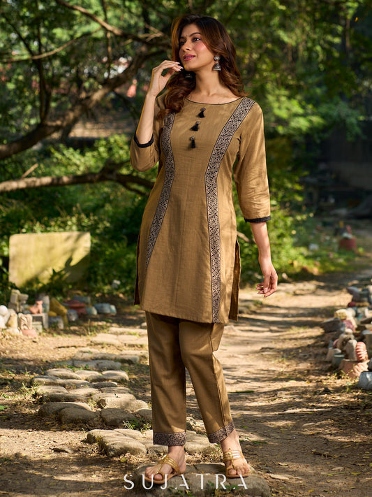 Minimal Sand Beige short kurta with a striking black Ajrakh border.