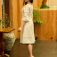 Ivory Rhythm Bell-Sleeved Dress with Hand Painted Dots and Crochet Charm