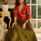 Luminous Green tissue lehenga with a classic Red Angrakha choli featuring intricate hand embroidery.