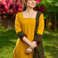 Elegant Mustard Cotton Kurta with Contrast Green Mughal Printed Border Panels
