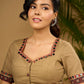 Exquisite hand embroidered dark beige ajrakh combination cotton blouse.