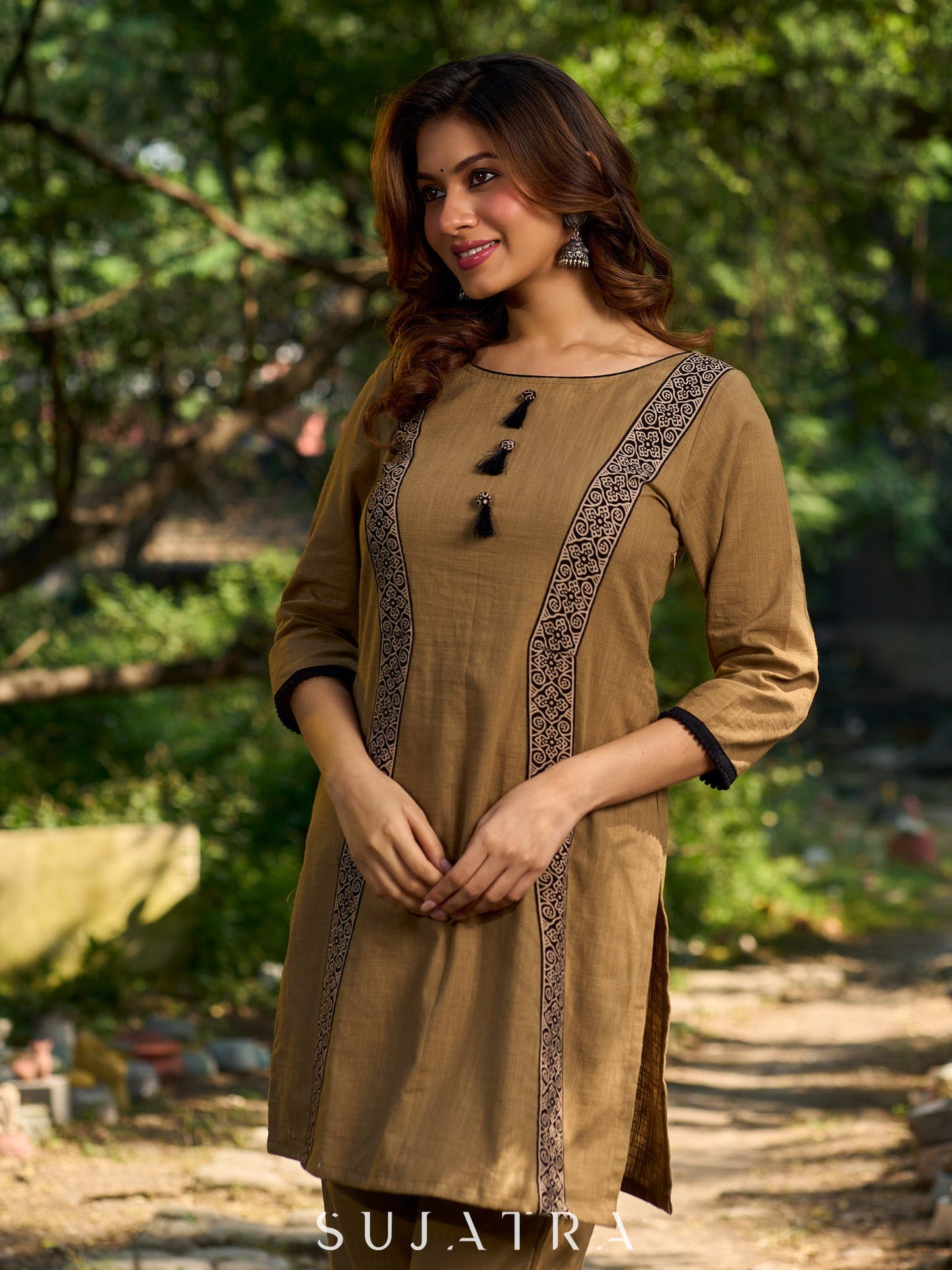 Minimal Sand Beige short kurta with a striking black Ajrakh border.