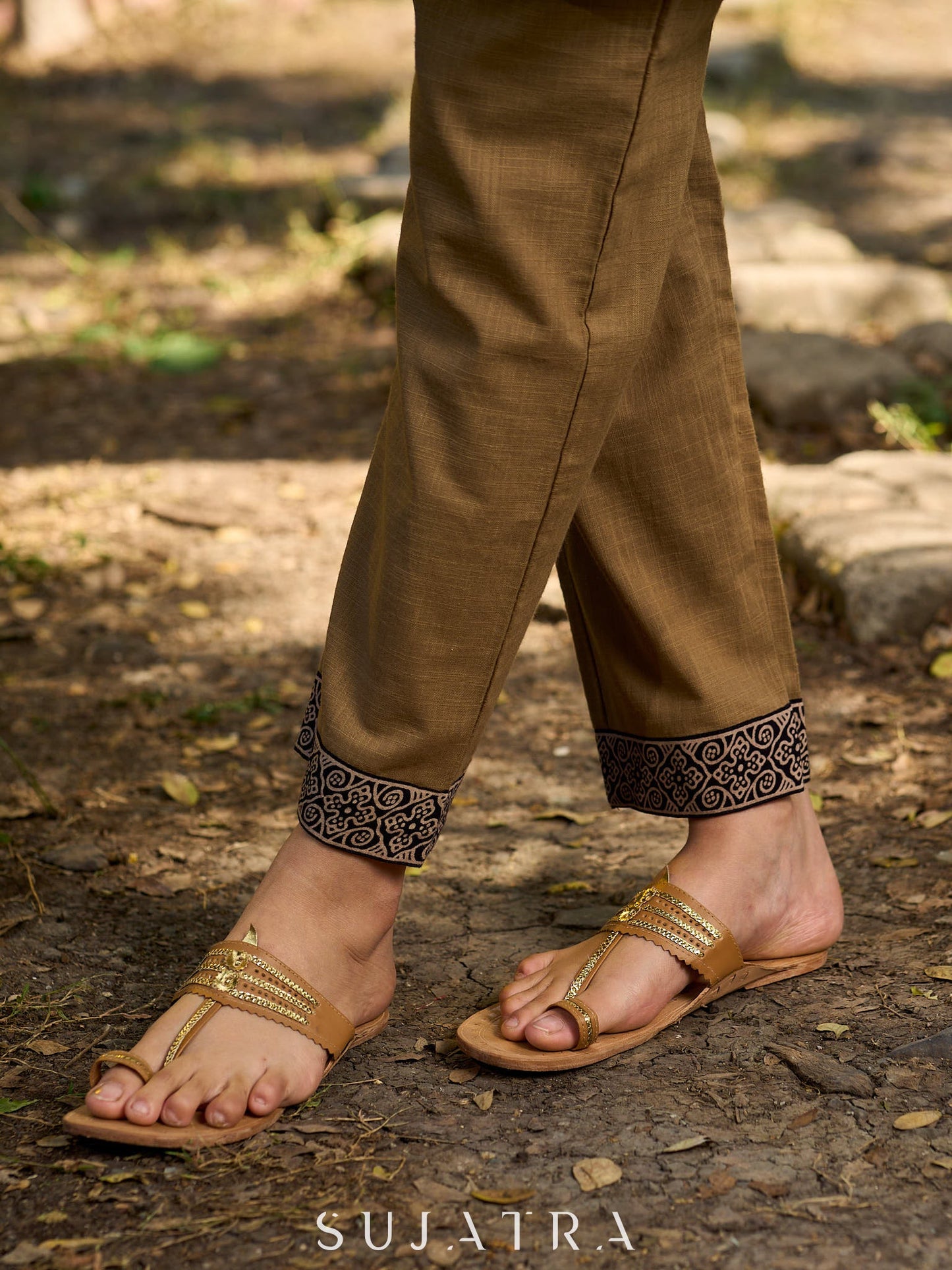 Minimal Sand Beige short kurta with a striking black Ajrakh border.
