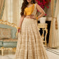 A chic off-white Hakoba Lehenga with intricate gold embroidery accented by a bold, saffron yellow blouse - Gold embroidered hakoba Shrug Optional