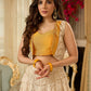 A chic off-white Hakoba Lehenga with intricate gold embroidery accented by a bold, saffron yellow blouse - Gold embroidered hakoba Shrug Optional
