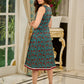 Flowy Green Floral Printed Cotton Dress with Flared Silhouette, Maroon Contrast Trims, and Crochet Lace Edges