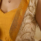 A chic off-white Hakoba Lehenga with intricate gold embroidery accented by a bold, saffron yellow blouse - Gold embroidered hakoba Shrug Optional