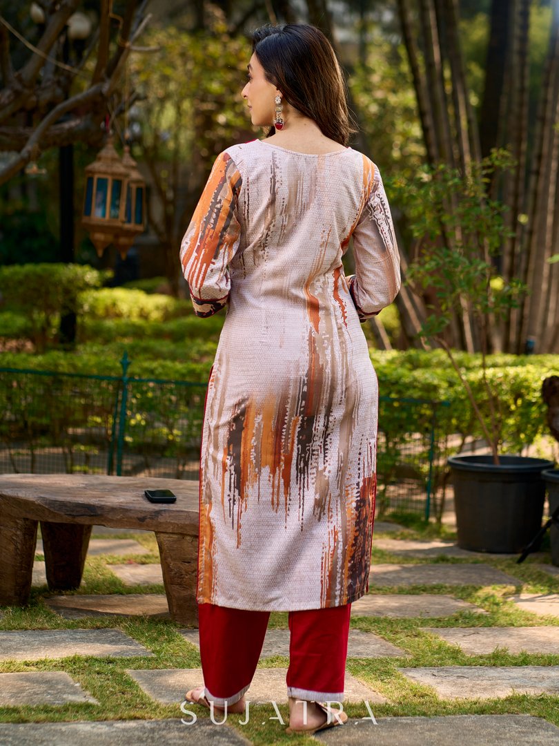 Artisanal off-white kurta showcasing Pichwai-inspired cow artwork highlighted with classic red tones