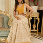 A chic off-white Hakoba Lehenga with intricate gold embroidery accented by a bold, saffron yellow blouse - Gold embroidered hakoba Shrug Optional